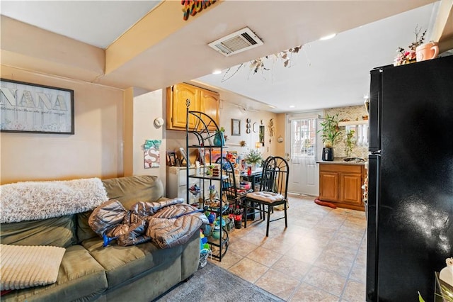 living room featuring visible vents