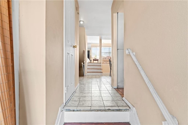 corridor featuring light tile patterned floors