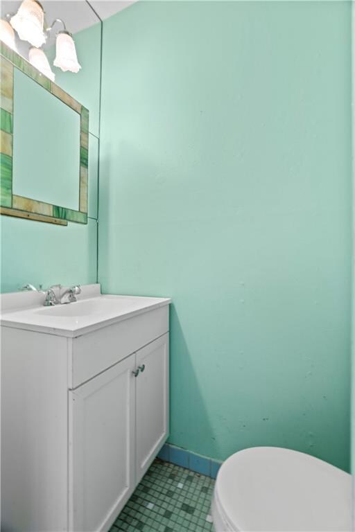 bathroom with vanity and toilet