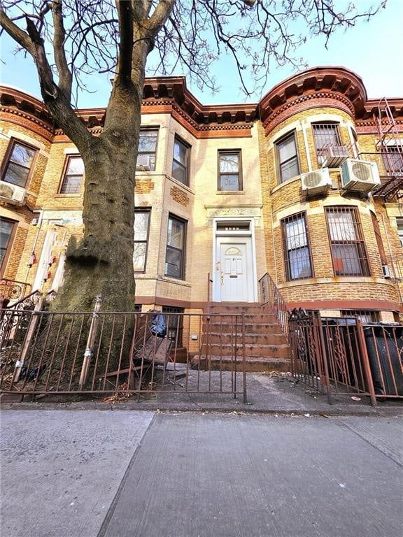 view of building exterior featuring a fenced front yard