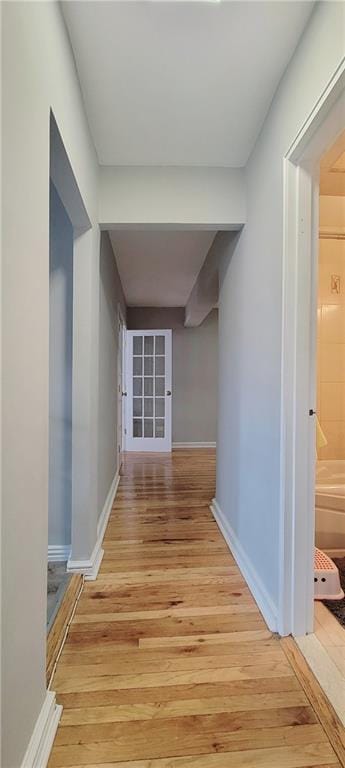 corridor featuring light hardwood / wood-style flooring