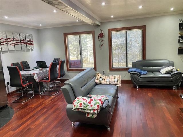 living room with ornamental molding and dark hardwood / wood-style floors