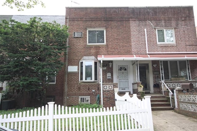 298 Bay 14th St, Brooklyn, NY 11214 - view of property with brick siding and covered porch