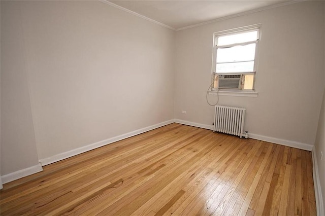 298 Bay 14th St, Brooklyn, NY 11214 - spare room with radiator, crown molding, light wood-style floors, and cooling unit