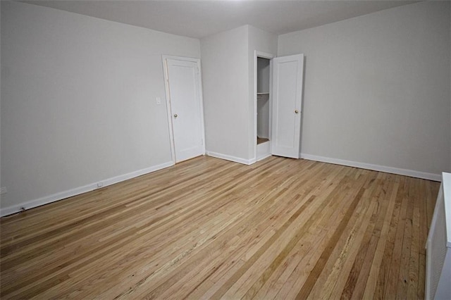 298 Bay 14th St, Brooklyn, NY 11214 - unfurnished bedroom featuring hardwood / wood-style floors and baseboards