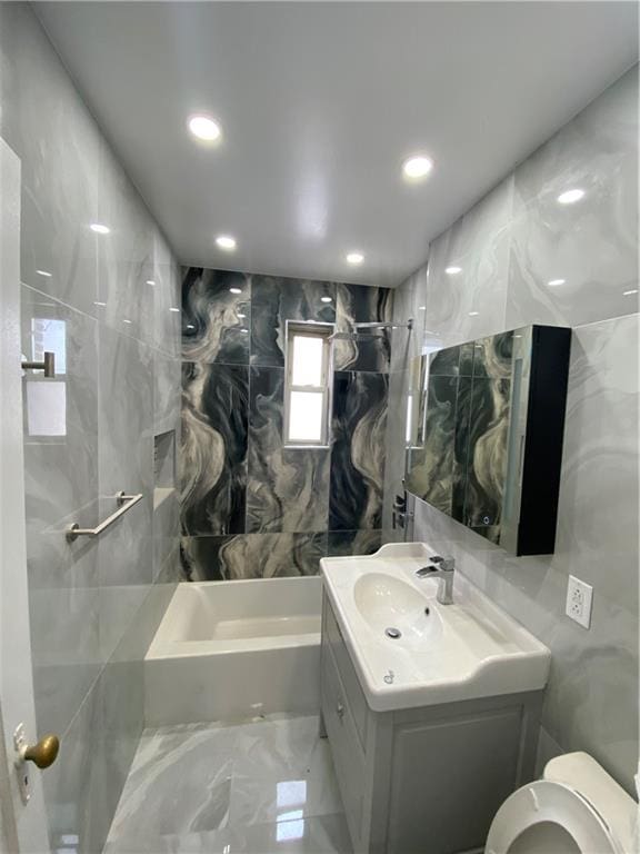 298 Bay 14th St, Brooklyn, NY 11214 - bathroom with toilet, vanity, tile walls, bathing tub / shower combination, and recessed lighting