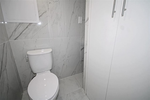 298 Bay 14th St, Brooklyn, NY 11214 - bathroom featuring marble finish floors and tile walls