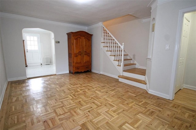 298 Bay 14th St, Brooklyn, NY 11214 - foyer featuring arched walkways, radiator, stairway, and ornamental molding