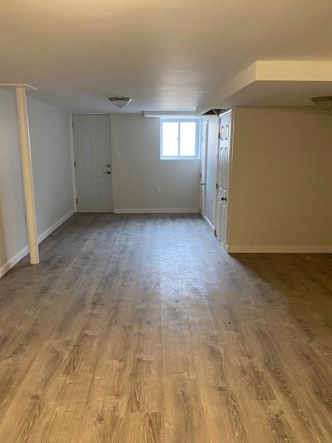 298 Bay 14th St, Brooklyn, NY 11214 - below grade area featuring wood finished floors and baseboards