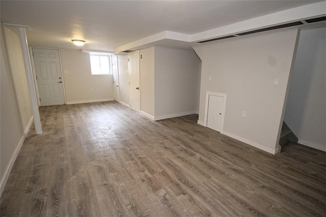 298 Bay 14th St, Brooklyn, NY 11214 - below grade area with dark wood finished floors and baseboards