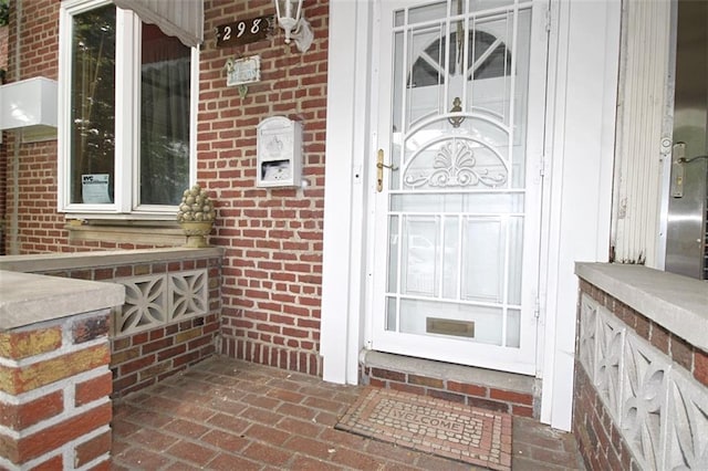 298 Bay 14th St, Brooklyn, NY 11214 - doorway to property with brick siding and covered porch