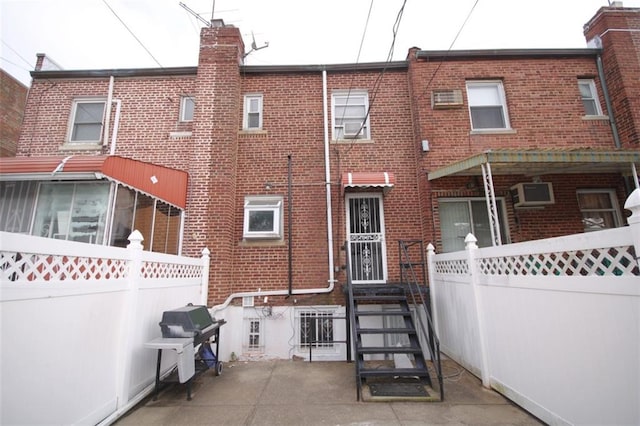 298 Bay 14th St, Brooklyn, NY 11214 - back of property featuring brick siding and a chimney
