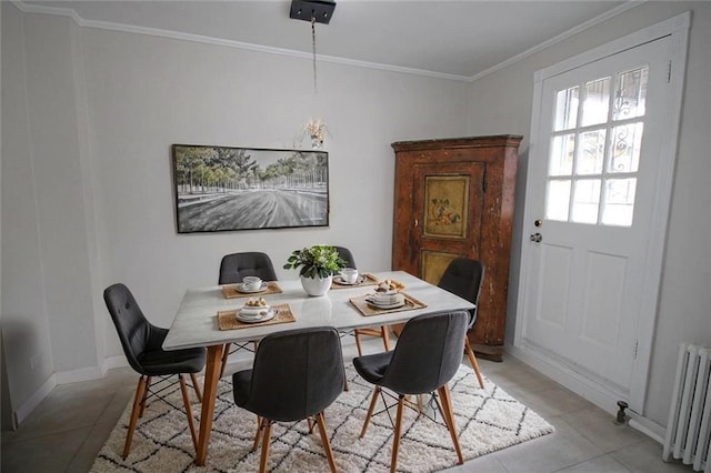 298 Bay 14th St, Brooklyn, NY 11214 - dining area featuring radiator heating unit, crown molding, and light tile patterned floors