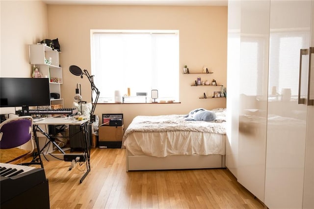 bedroom featuring light wood-style floors