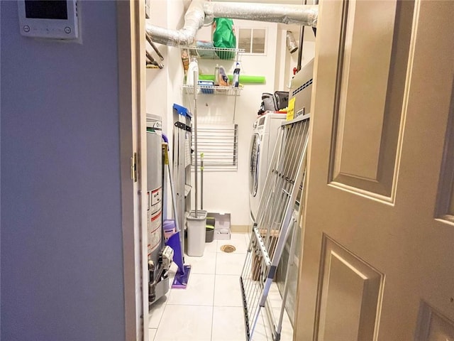 washroom featuring washer / dryer, laundry area, visible vents, and light tile patterned floors