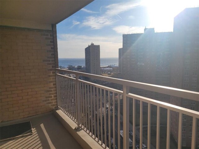 balcony featuring a water view