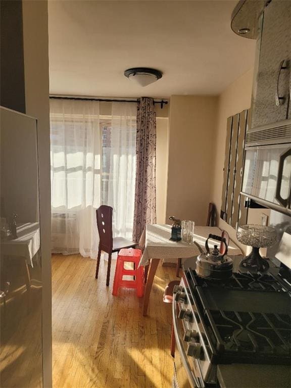 dining area featuring light wood-type flooring