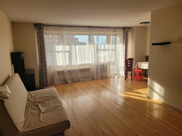 interior space featuring baseboards and wood finished floors