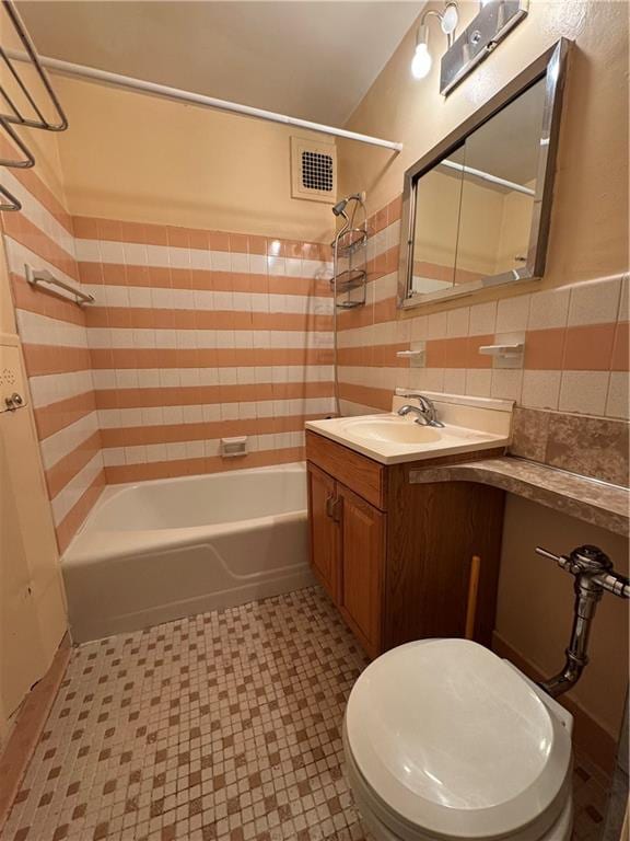 1580 E 13th St Unit 7G, Brooklyn, NY 11230 - bathroom with  shower combination, vanity, toilet, tile patterned floors, and tile walls