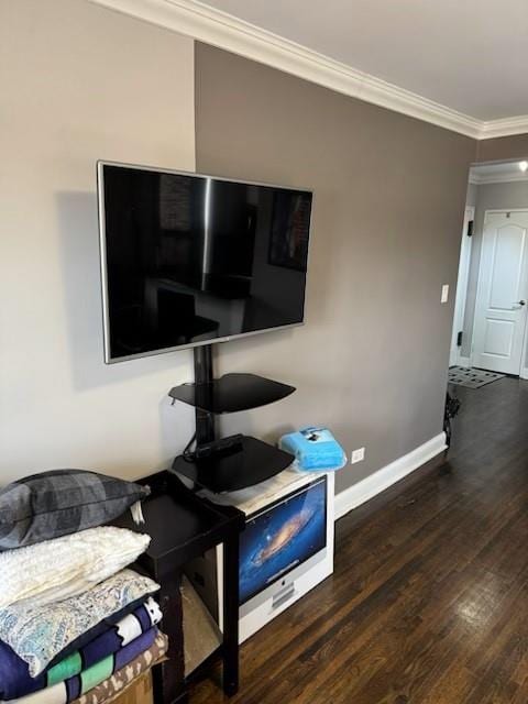 home office featuring baseboards, wood finished floors, and ornamental molding