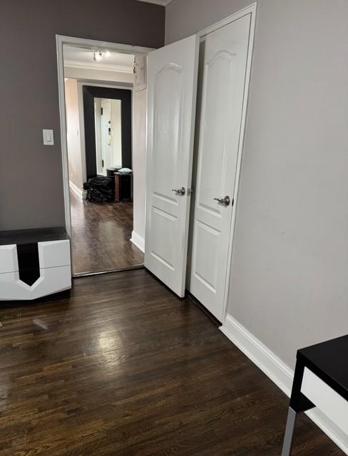 393 Avenue S Unit 5H, Brooklyn, NY 11223 - hall with dark wood-style flooring and baseboards