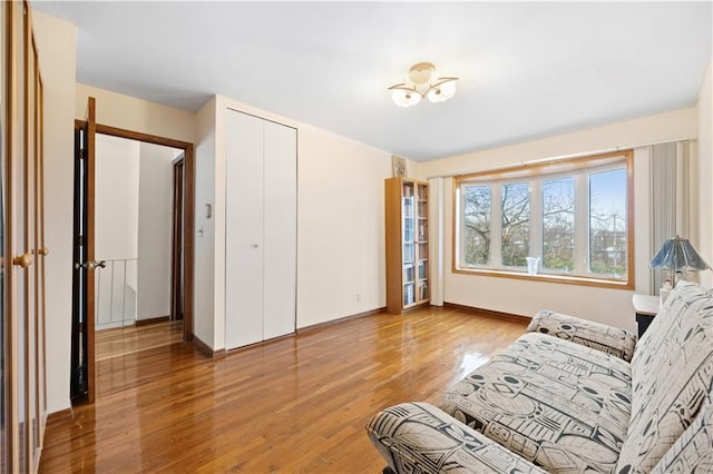 living area featuring wood finished floors and baseboards