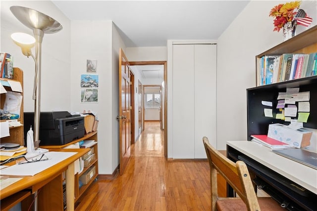 office with light wood-type flooring