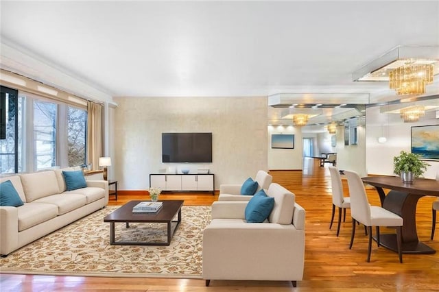 42 Narrows Rd S Unit 1, Staten Island, NY 10305 - living room with wood finished floors and a chandelier