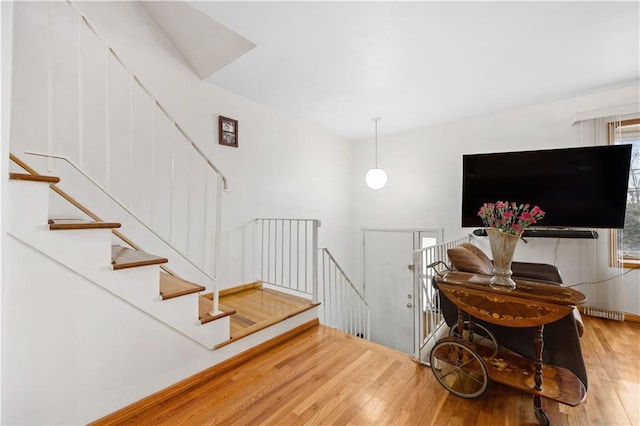 staircase featuring hardwood / wood-style floors