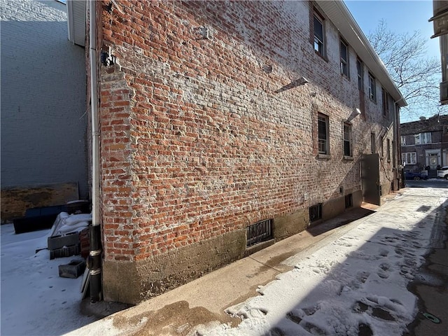 view of property exterior with brick siding