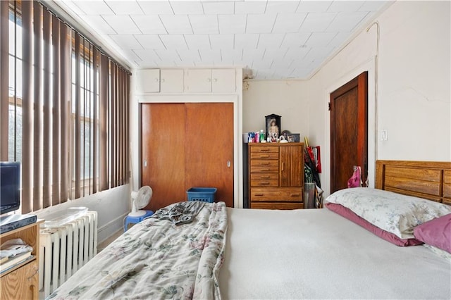 bedroom featuring radiator