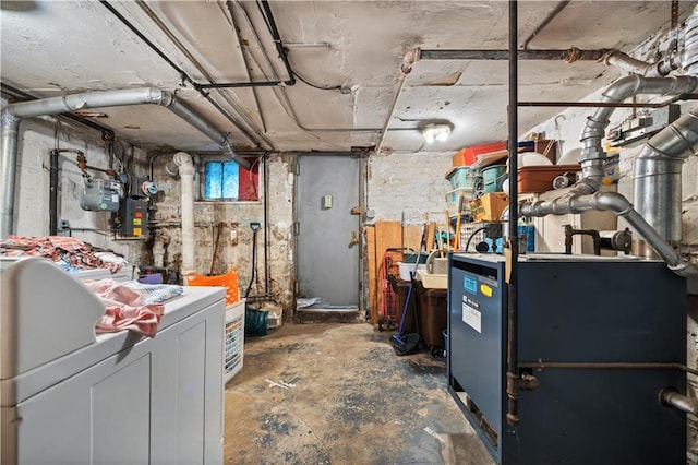 basement featuring washer / dryer and electric panel