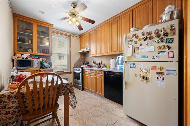 kitchen featuring light tile patterned flooring, appliances with stainless steel finishes, ceiling fan, and decorative backsplash