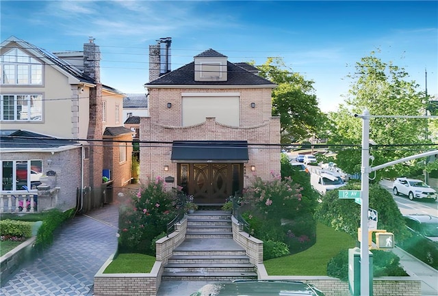 rear view of house with brick siding