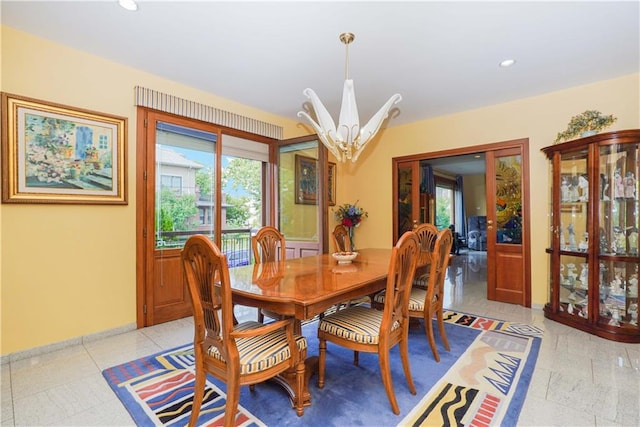 dining area with a chandelier, recessed lighting, and a healthy amount of sunlight