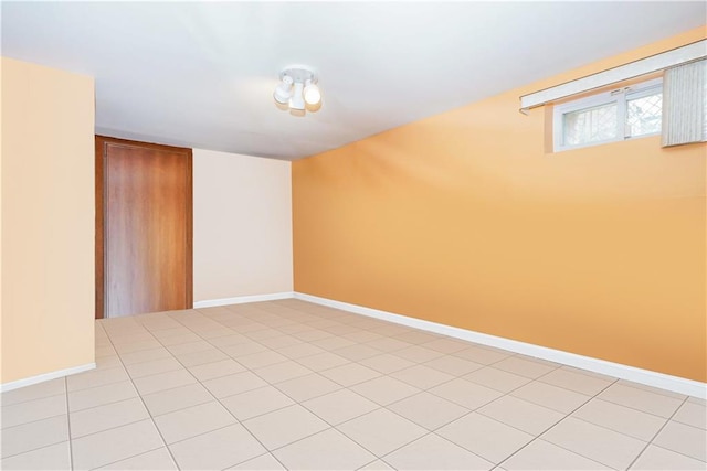 spare room with baseboards