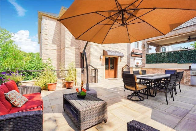 view of patio with outdoor dining space, outdoor lounge area, and fence