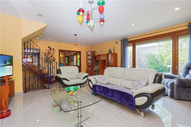 living room featuring plenty of natural light, stairs, visible vents, and recessed lighting