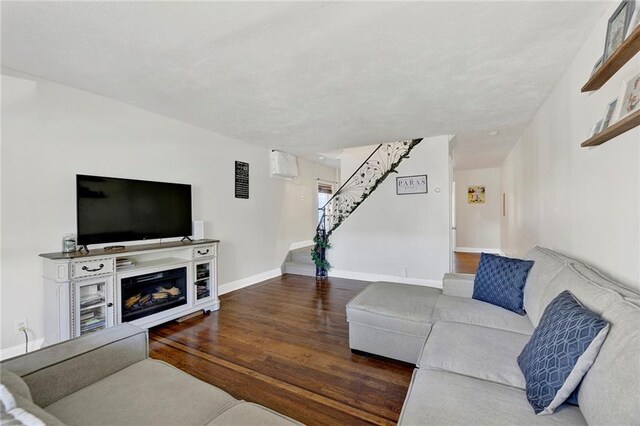 living room with dark hardwood / wood-style floors