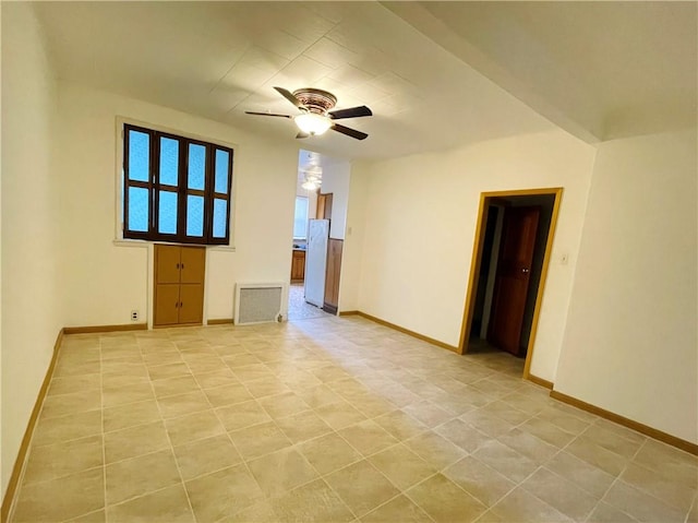 empty room with baseboards and a ceiling fan