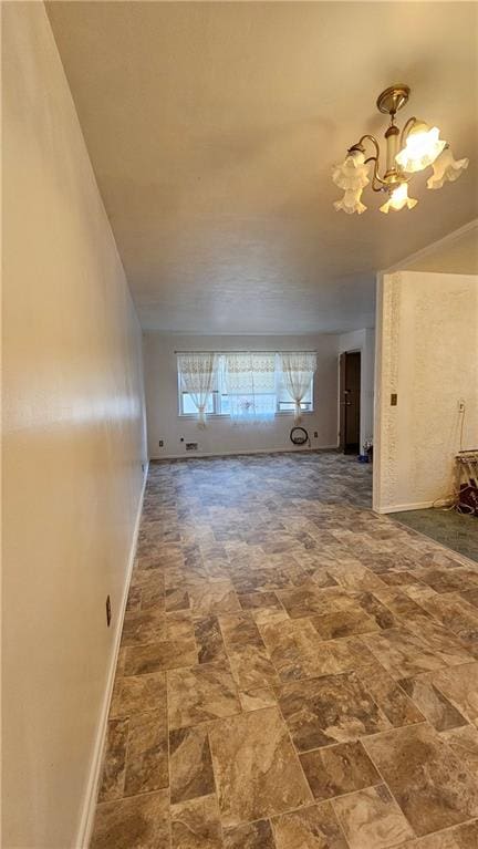 unfurnished living room with a notable chandelier