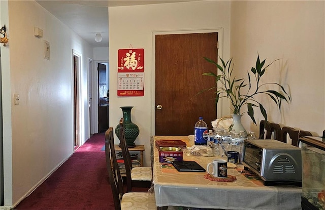 corridor with carpet flooring