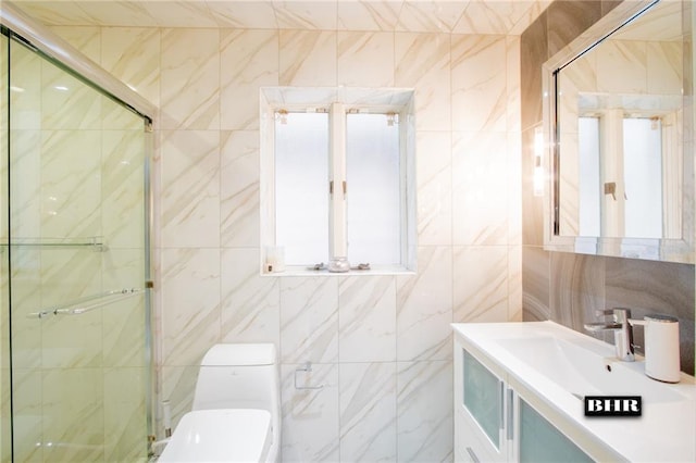 bathroom featuring vanity, toilet, tile walls, and a shower stall