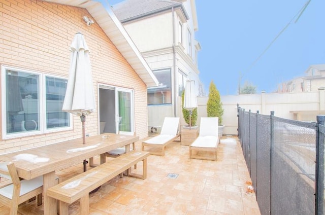 view of patio / terrace featuring outdoor dining space and a fenced backyard