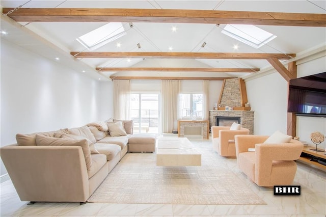 living room with high vaulted ceiling, a skylight, beamed ceiling, and a stone fireplace