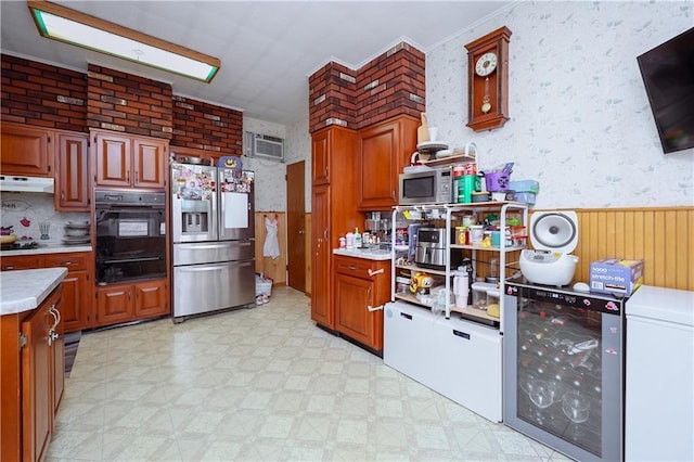 kitchen with stainless steel appliances, beverage cooler, and a wall unit AC