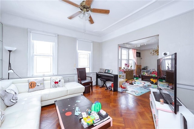 living room with ceiling fan and dark parquet flooring