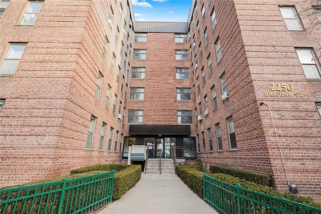 view of building exterior featuring fence