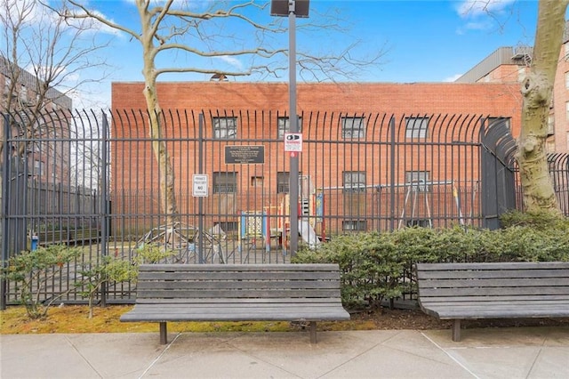 view of gate with fence