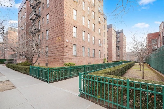 view of building exterior with fence